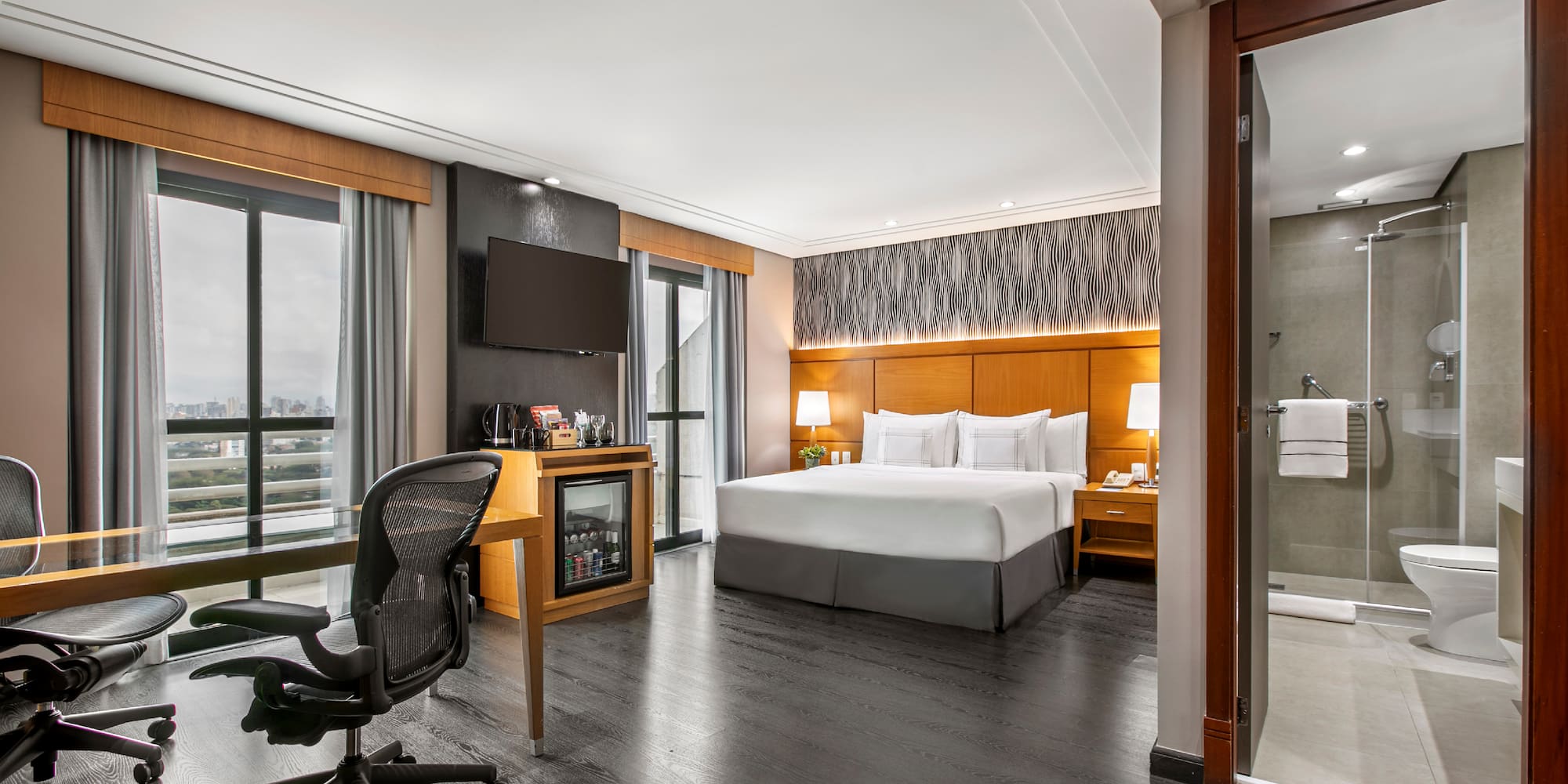 a room with a bed and a desk