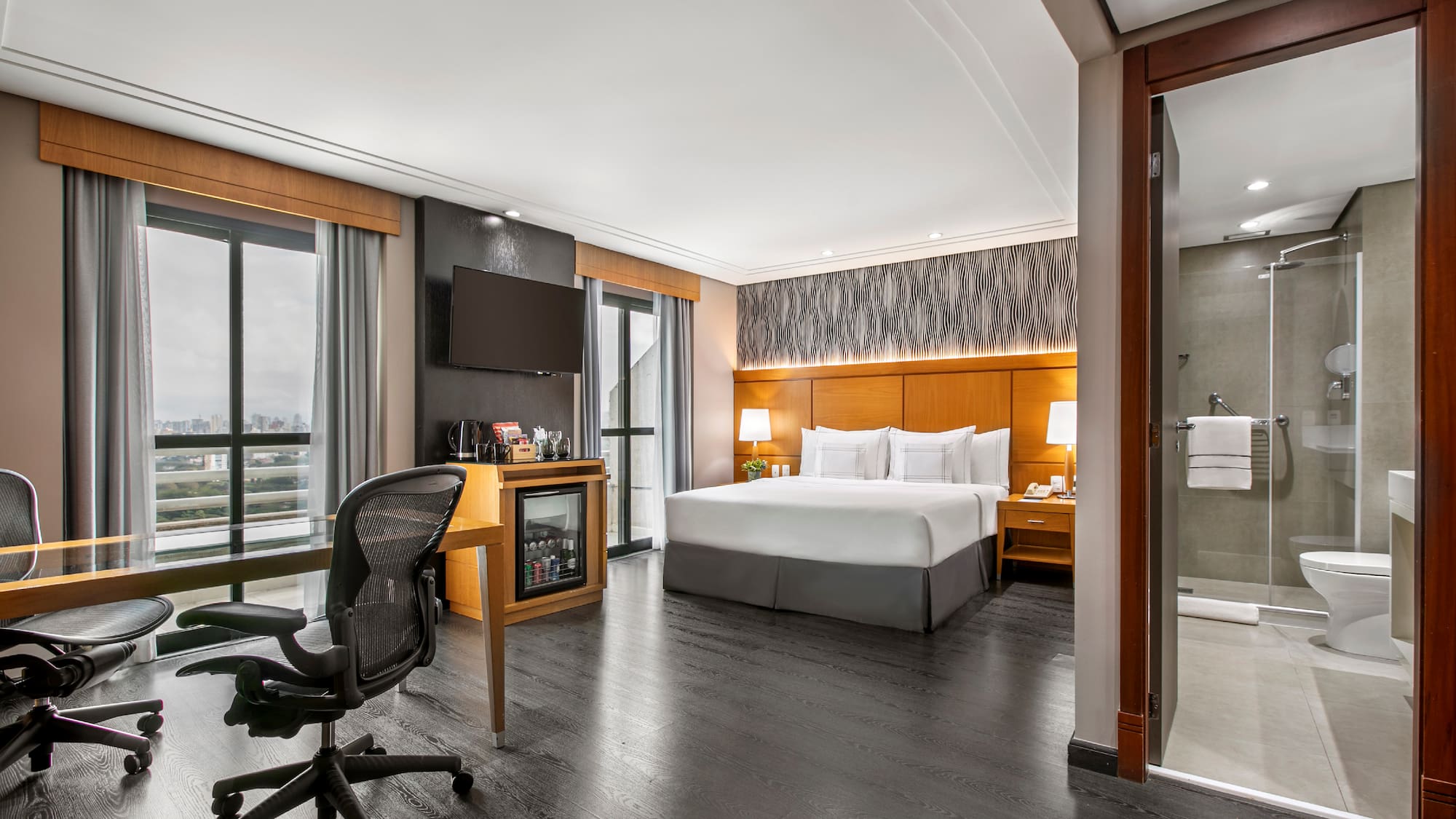 a room with a bed and a desk