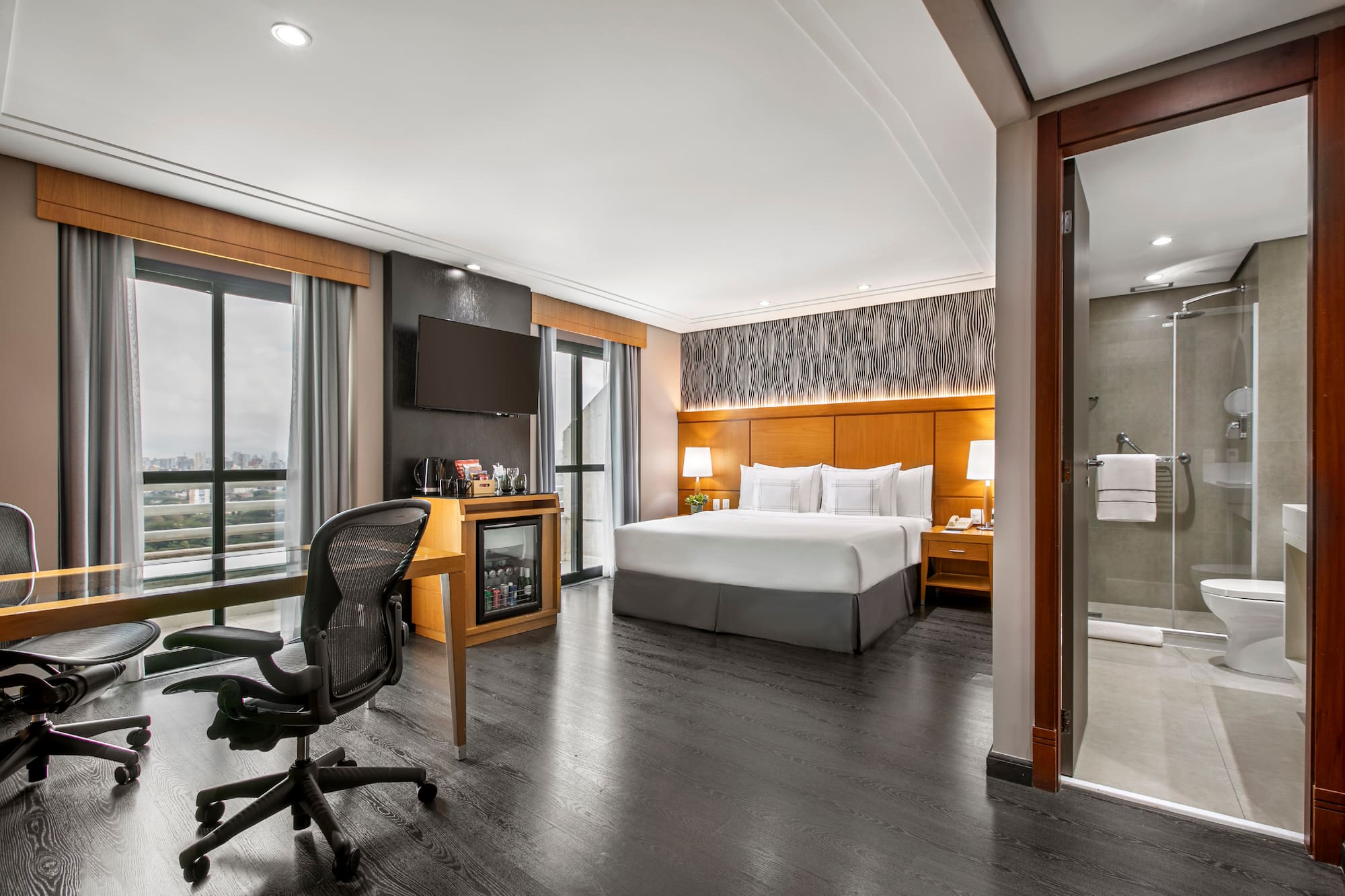 a room with a bed and a desk