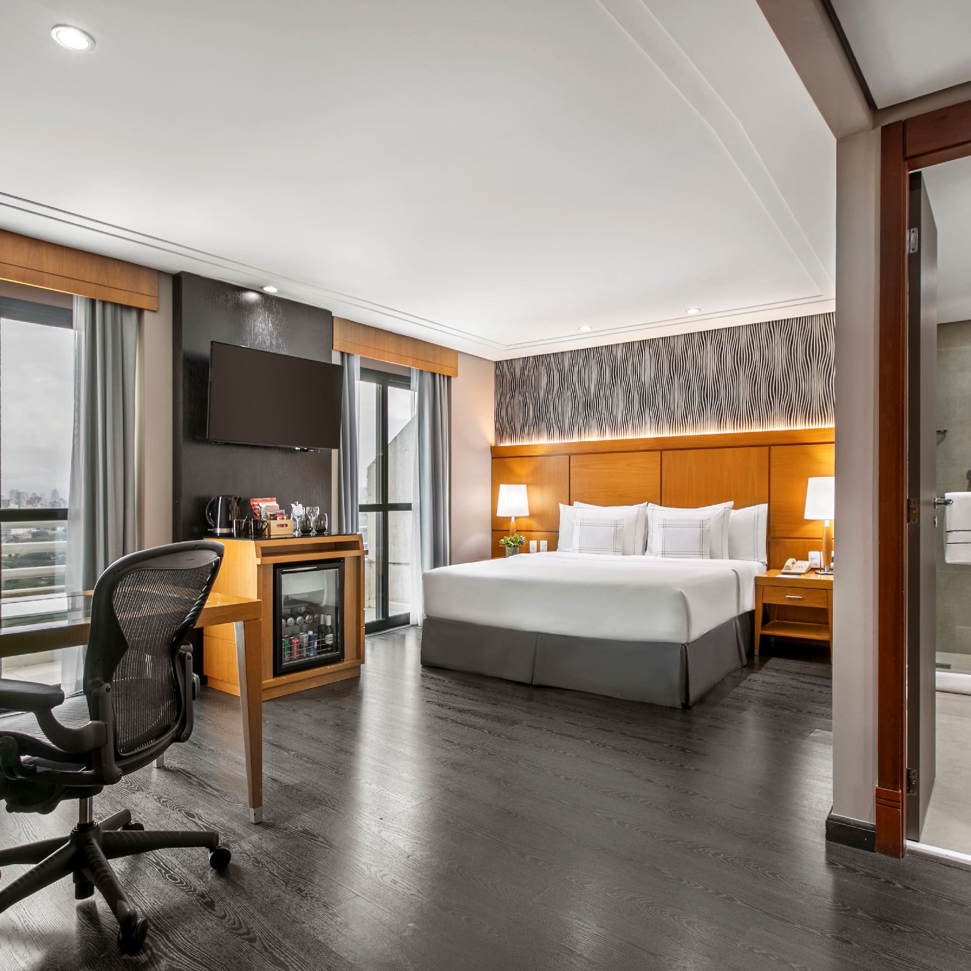 a room with a bed and a desk