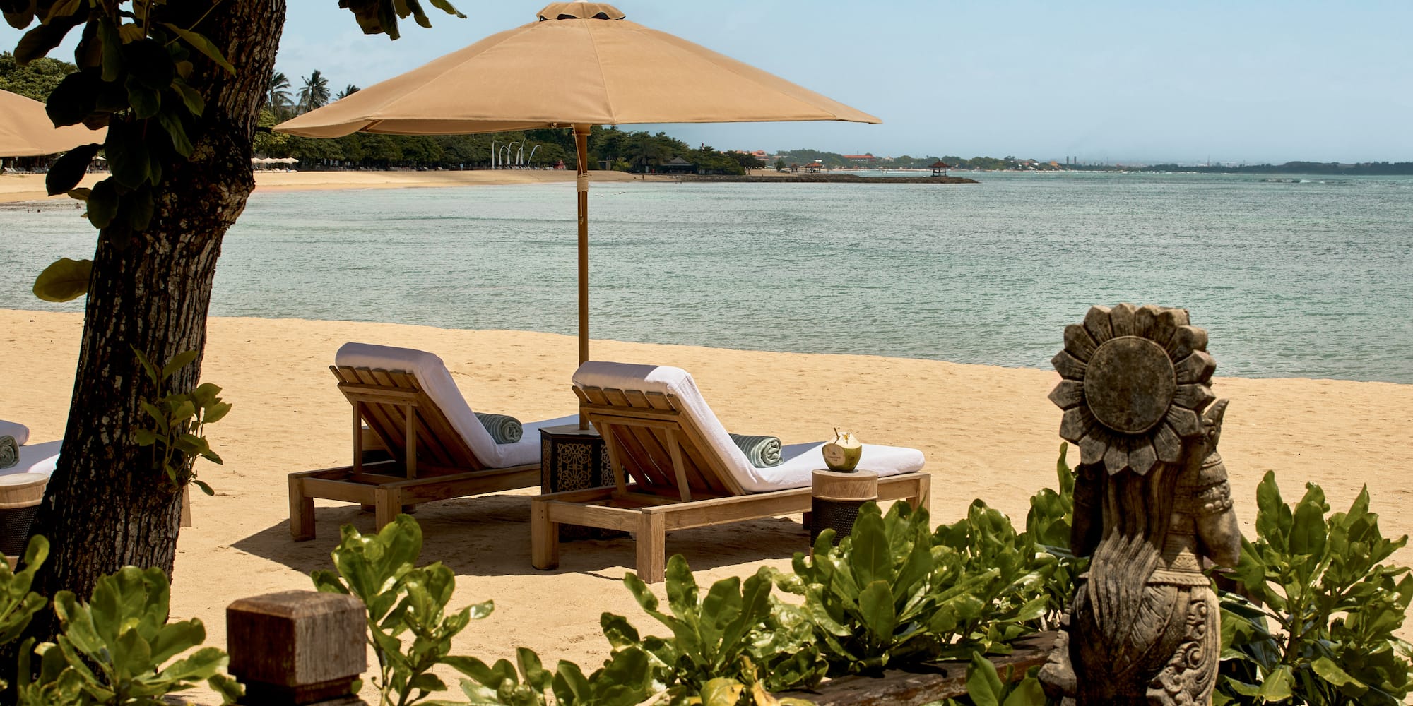 chairs on a beach with a umbrella