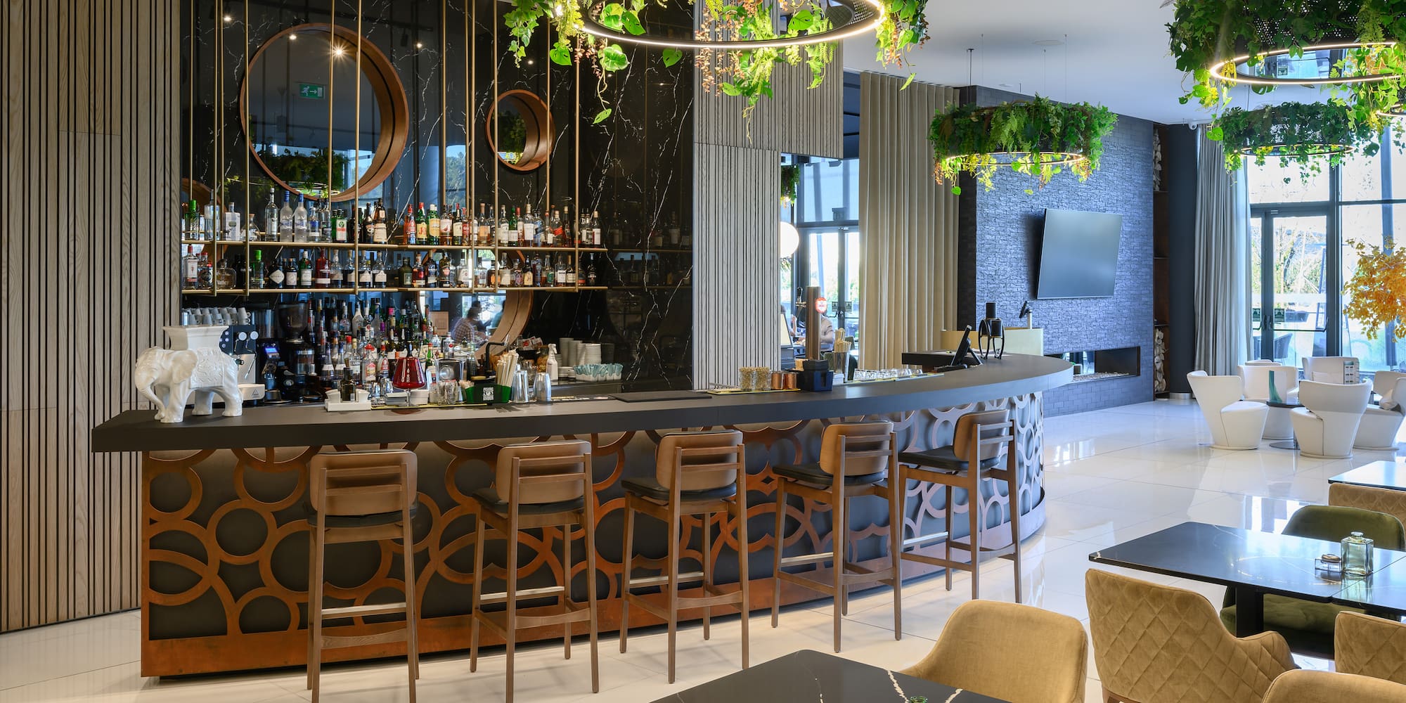 a bar with a large counter and chairs