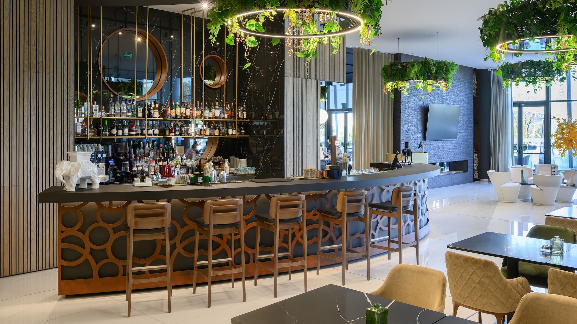 a bar with a large counter and chairs