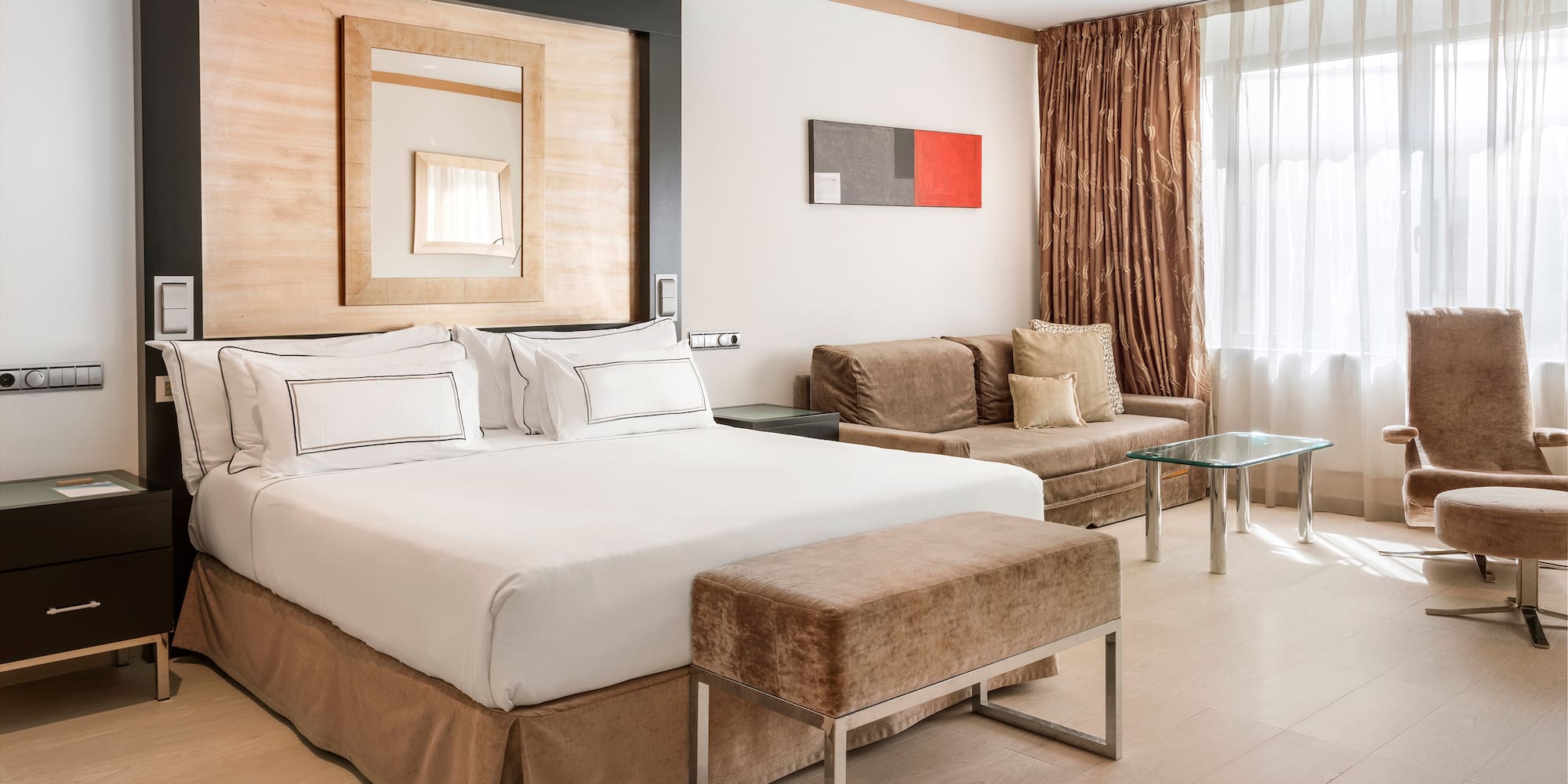 a bedroom with a bed and a couch