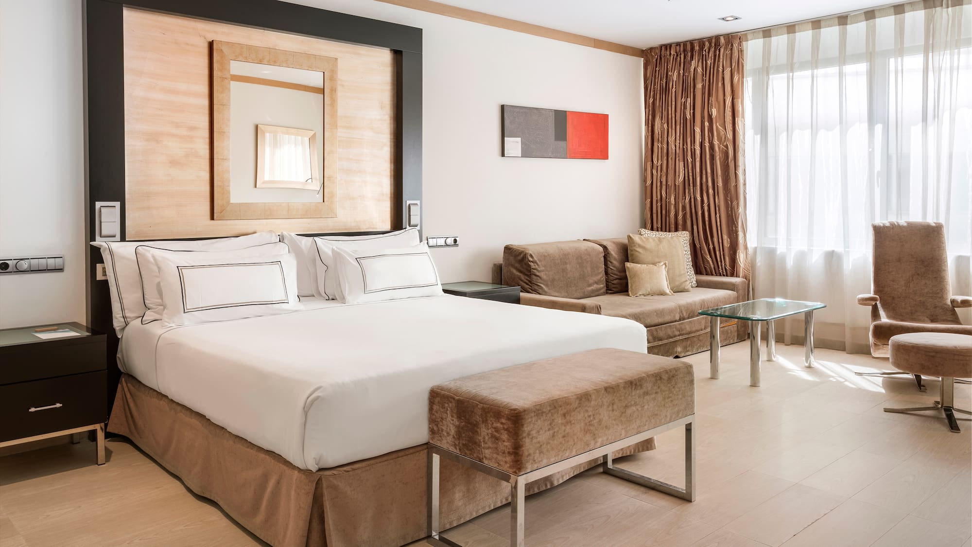 a bedroom with a bed and a couch