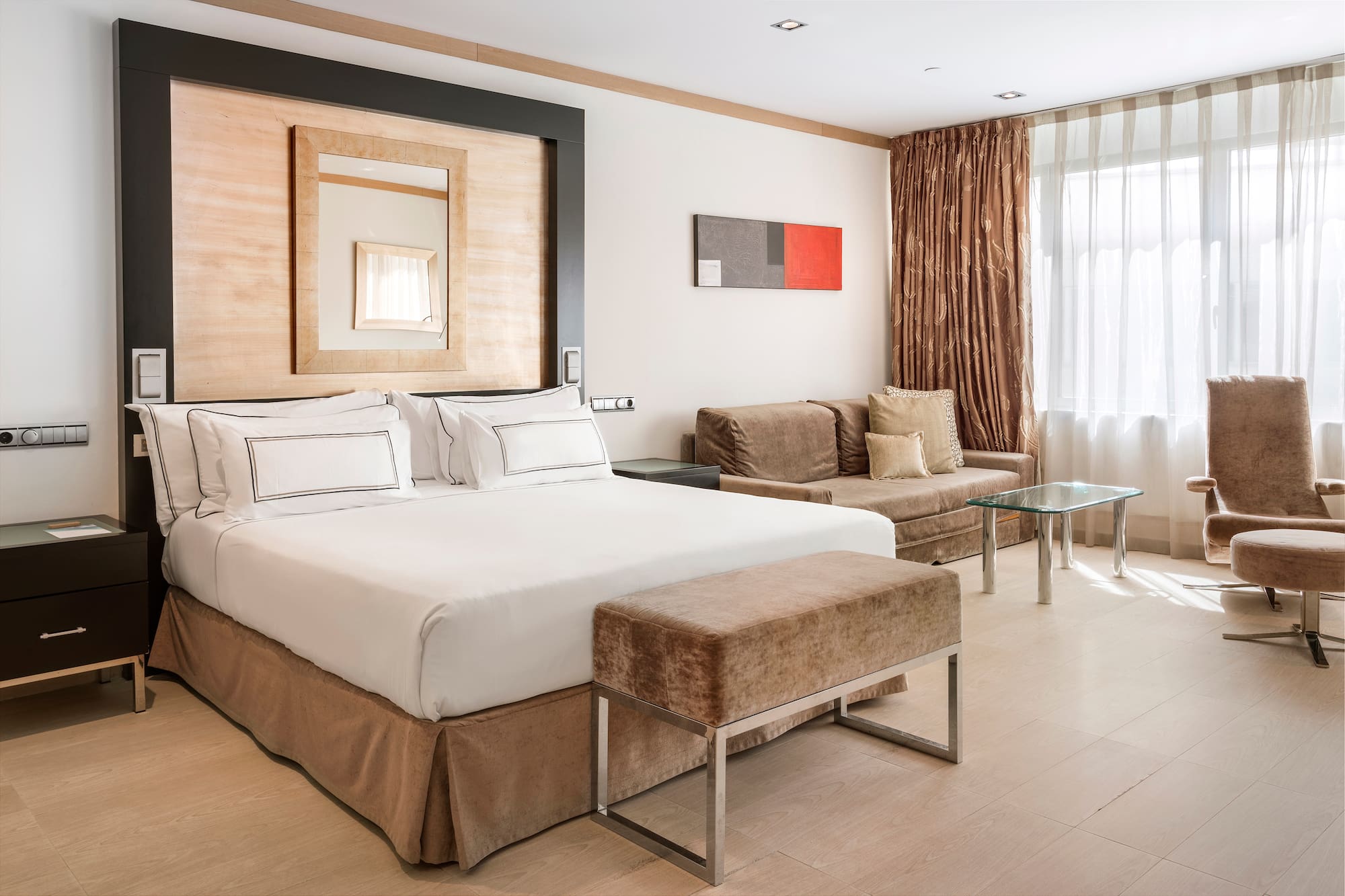 a bedroom with a bed and a couch