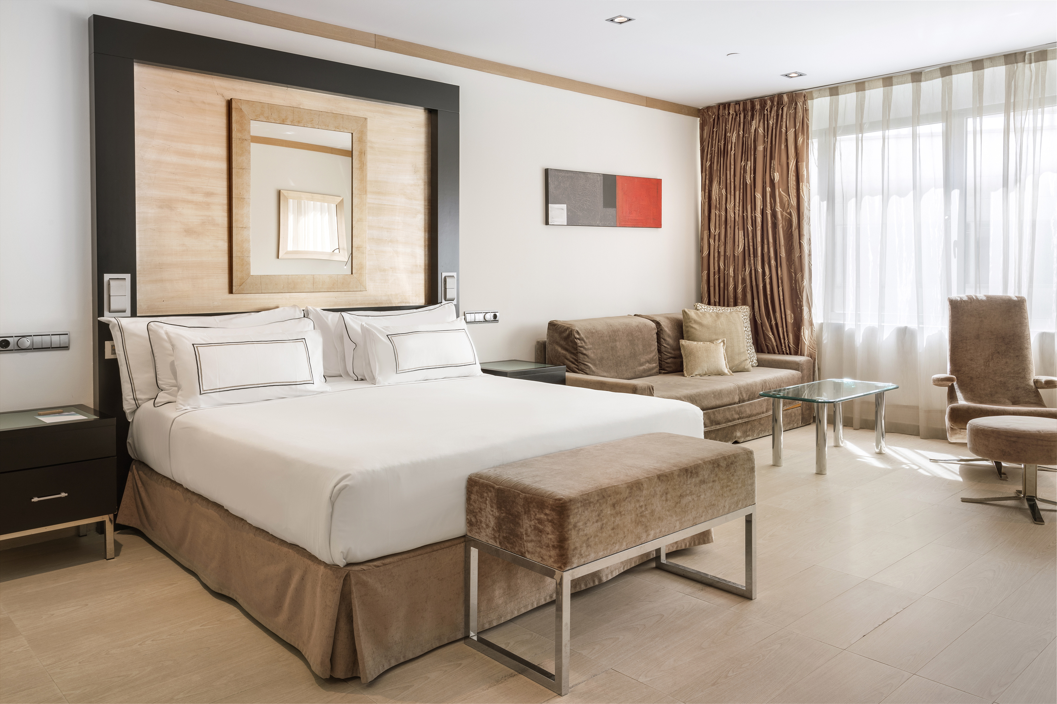 a bedroom with a bed and a couch