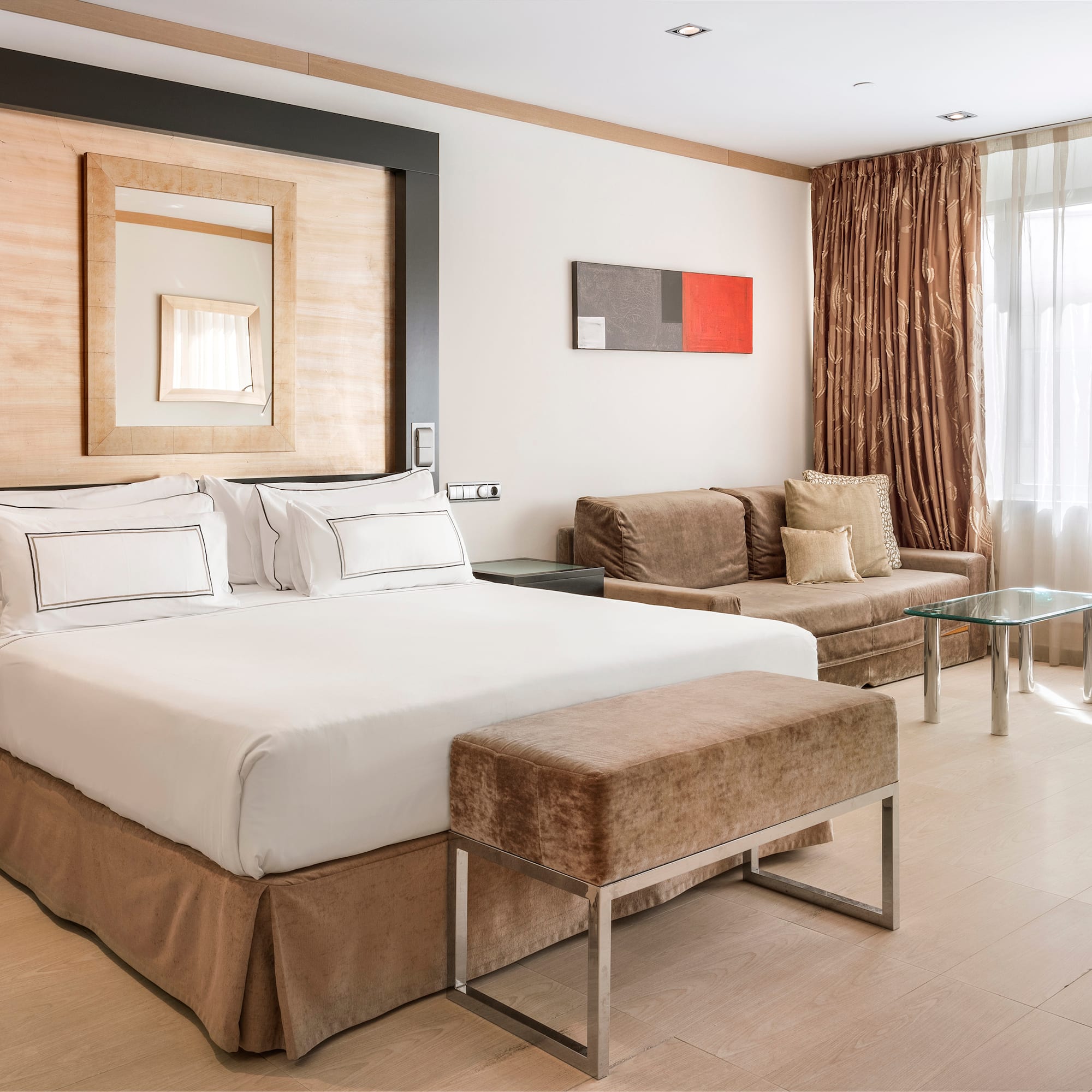 a bedroom with a bed and a couch