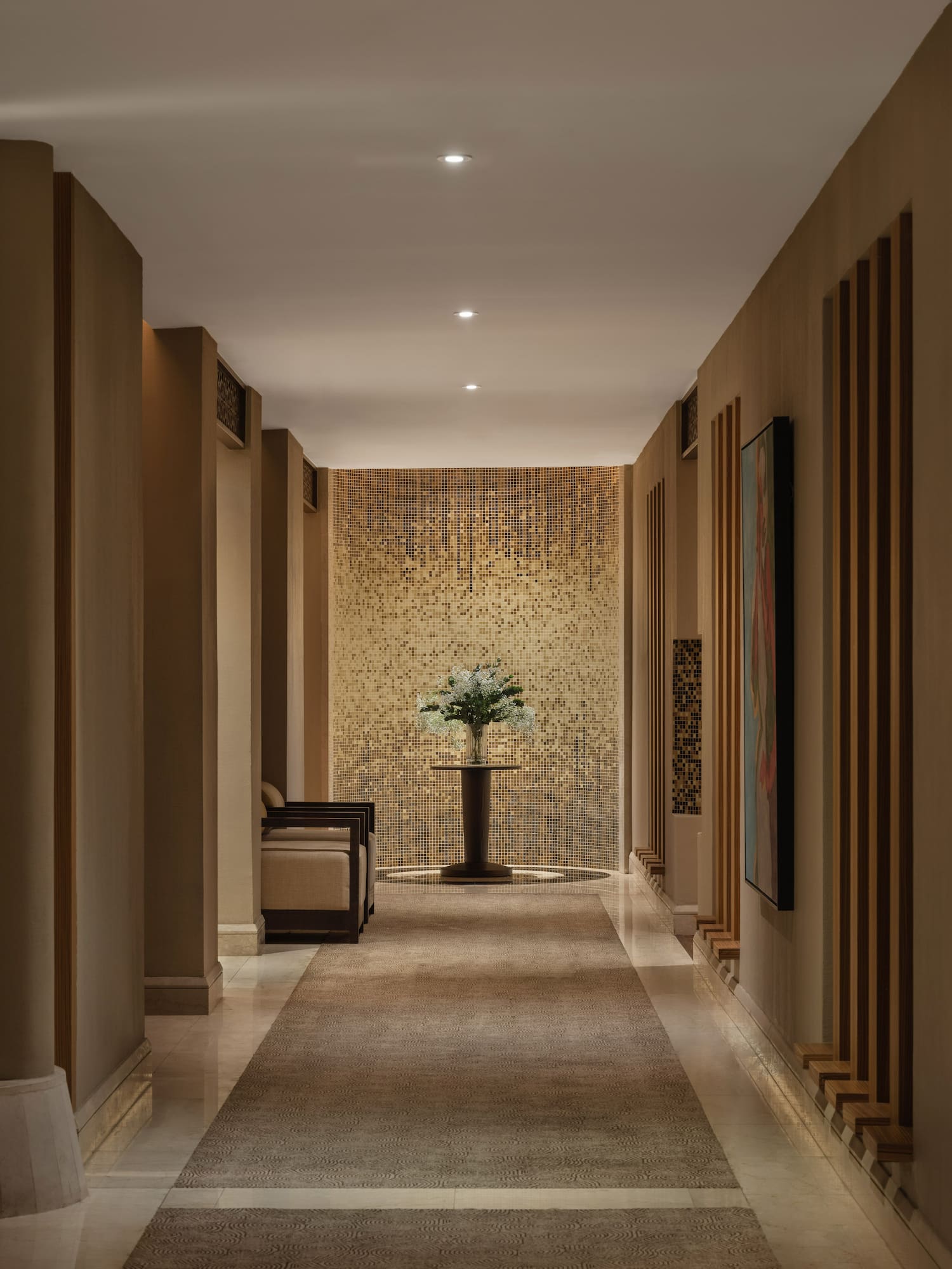 a hallway with a vase of flowers