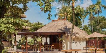 a building with tables and benches