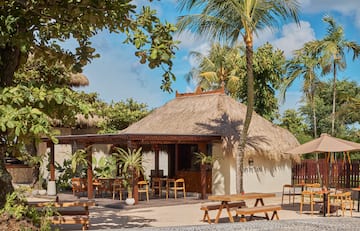a building with tables and benches