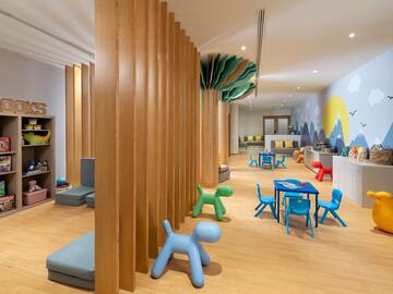 a room with wooden columns and toys