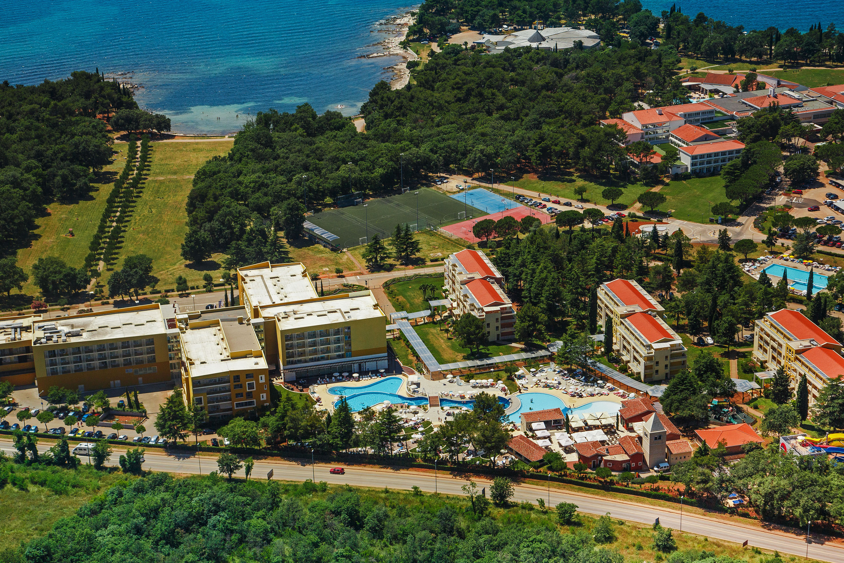 a group of buildings next to a body of water