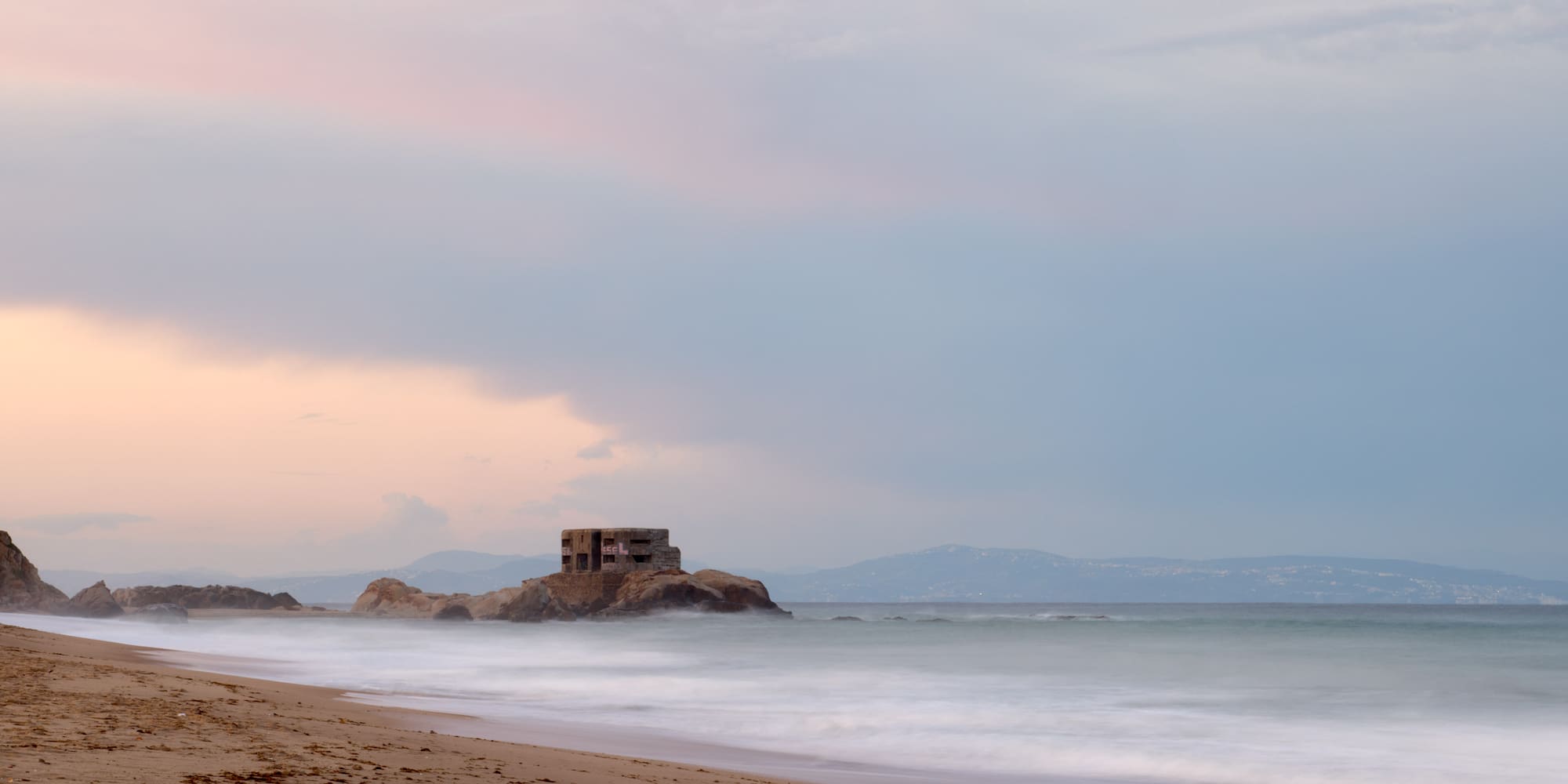 a beach with a building on it
