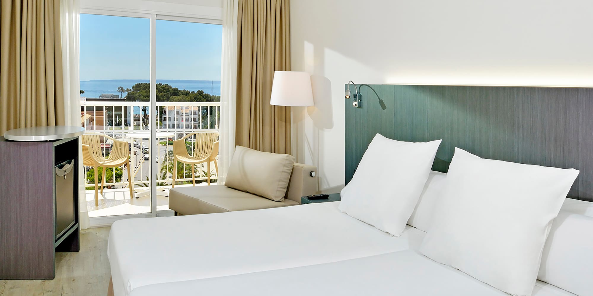 a room with a bed and a balcony