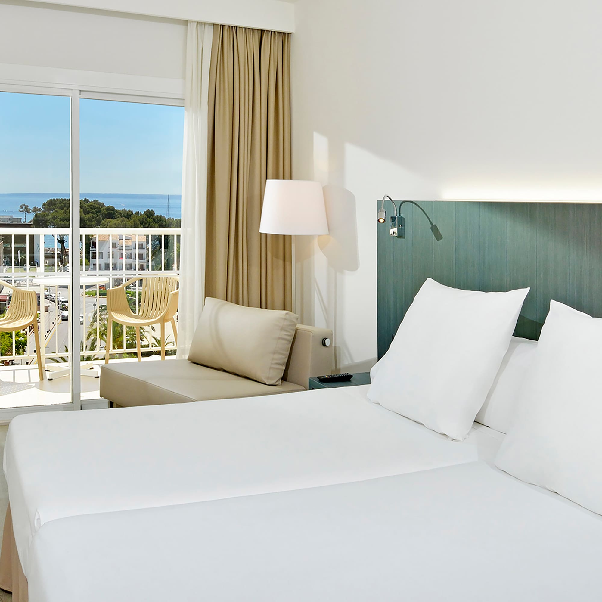 a room with a bed and a balcony