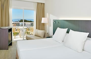 a room with a bed and a balcony