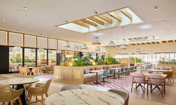 a restaurant with tables and chairs