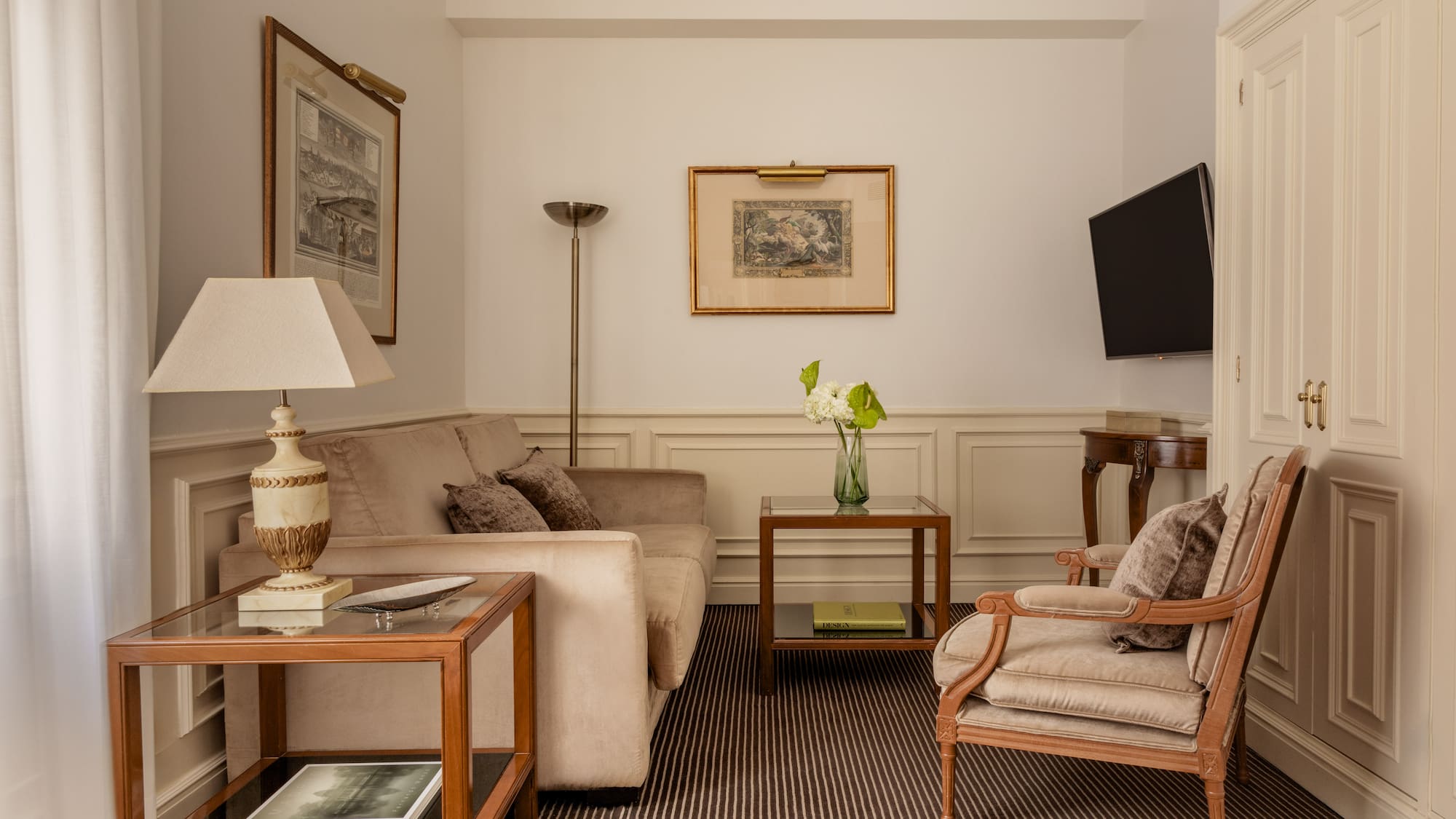 a living room with a television and couches