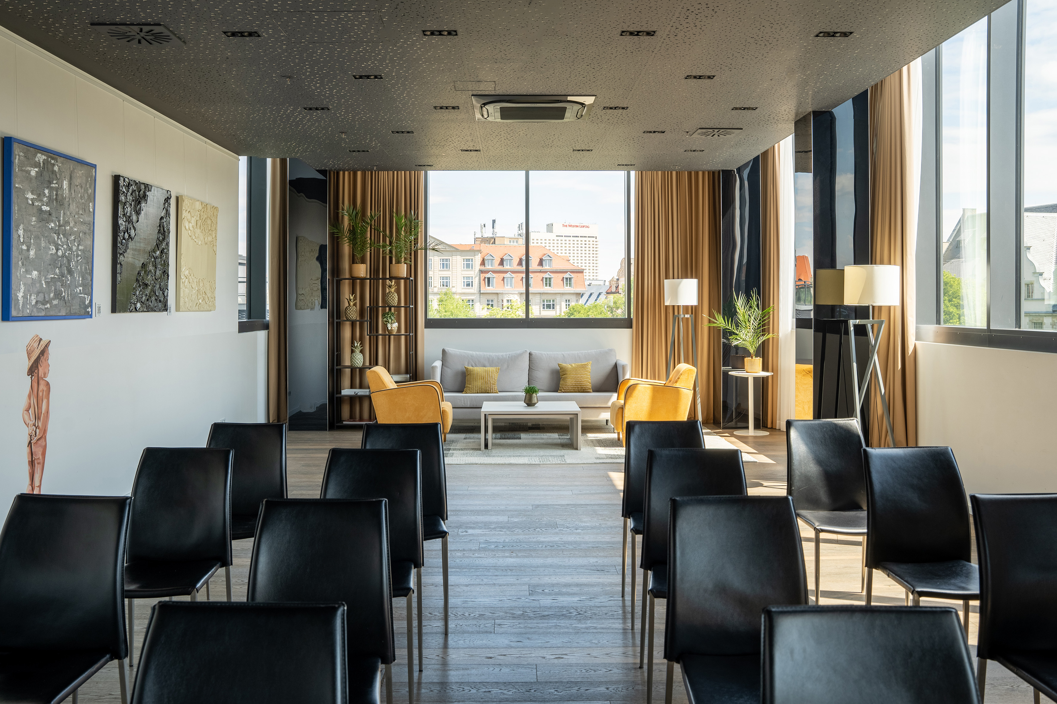 a room with chairs and a couch