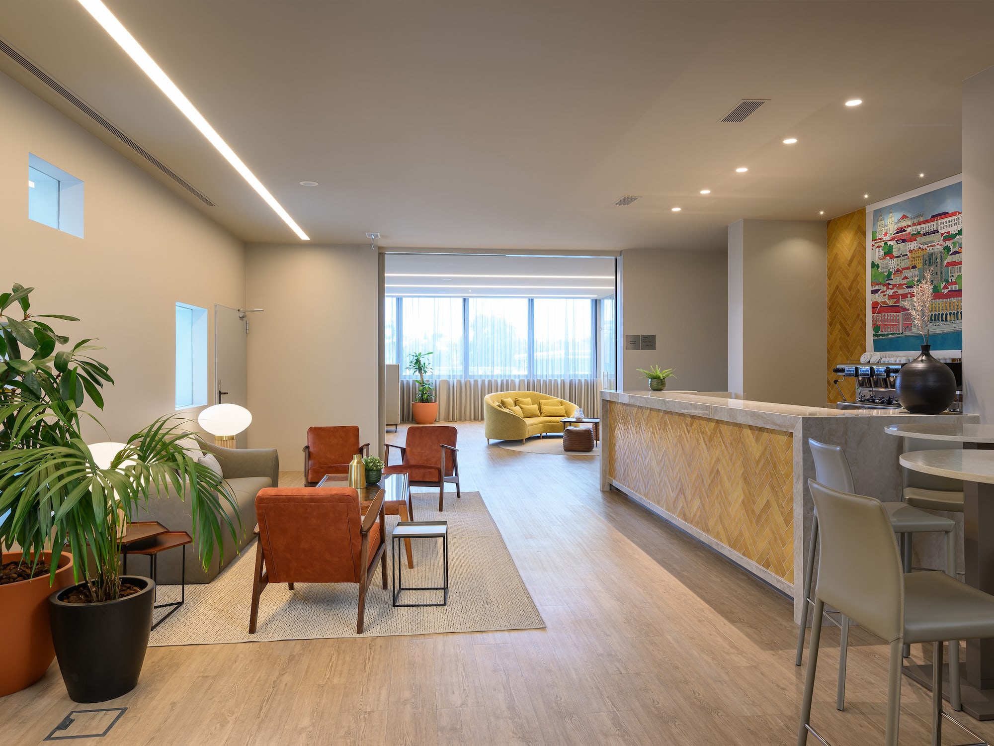 a room with a reception desk and chairs