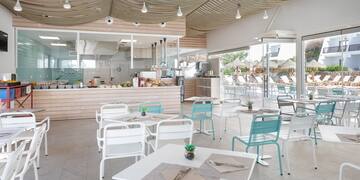 a restaurant with tables and chairs