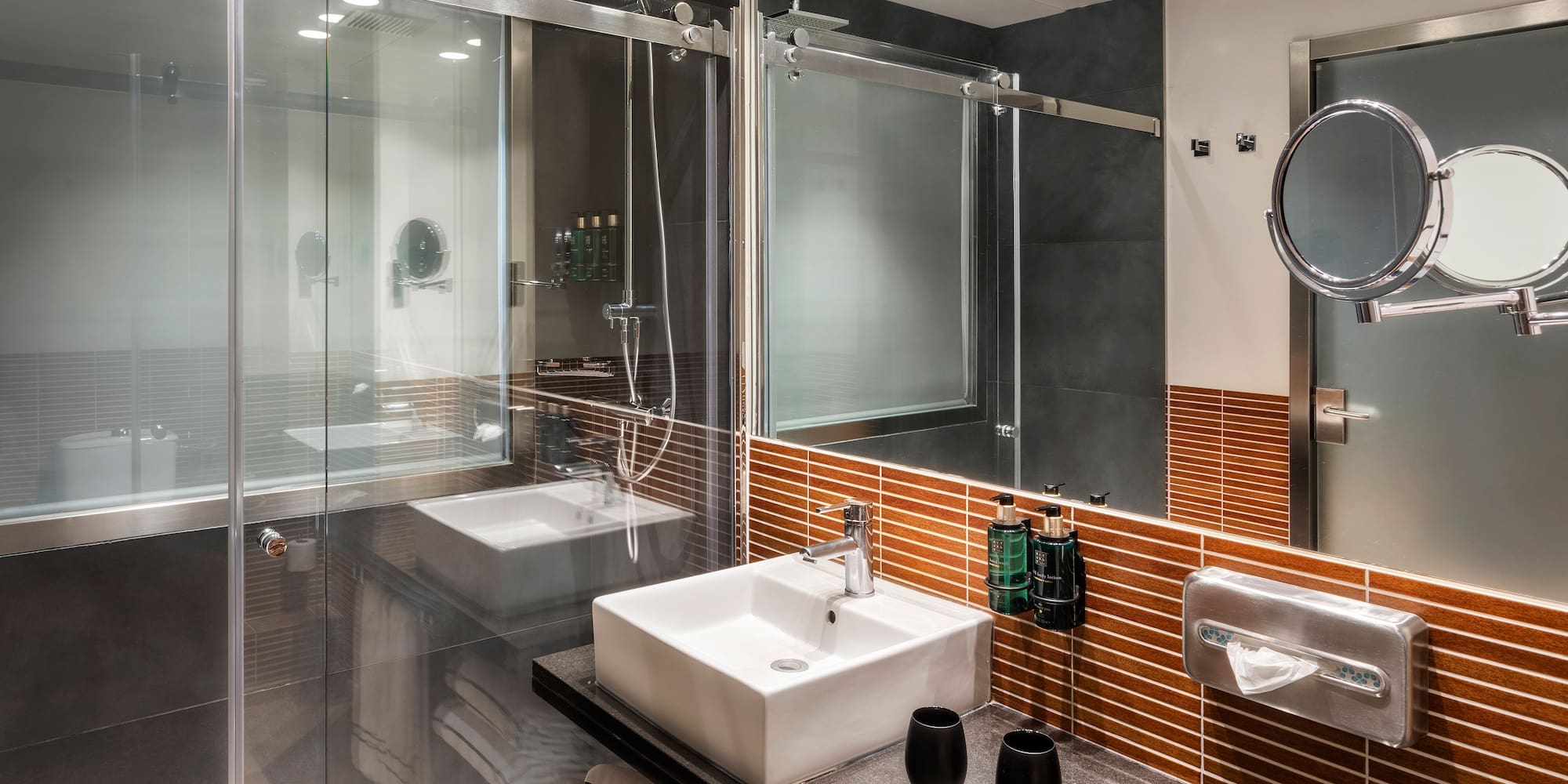 a bathroom with a glass shower door