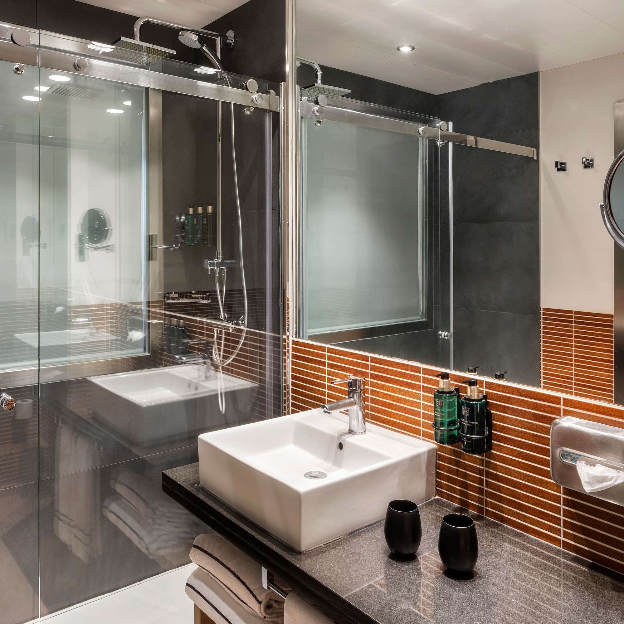 a bathroom with a glass shower door