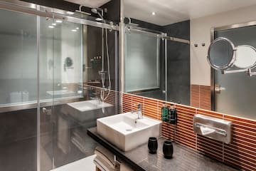 a bathroom with a glass shower door