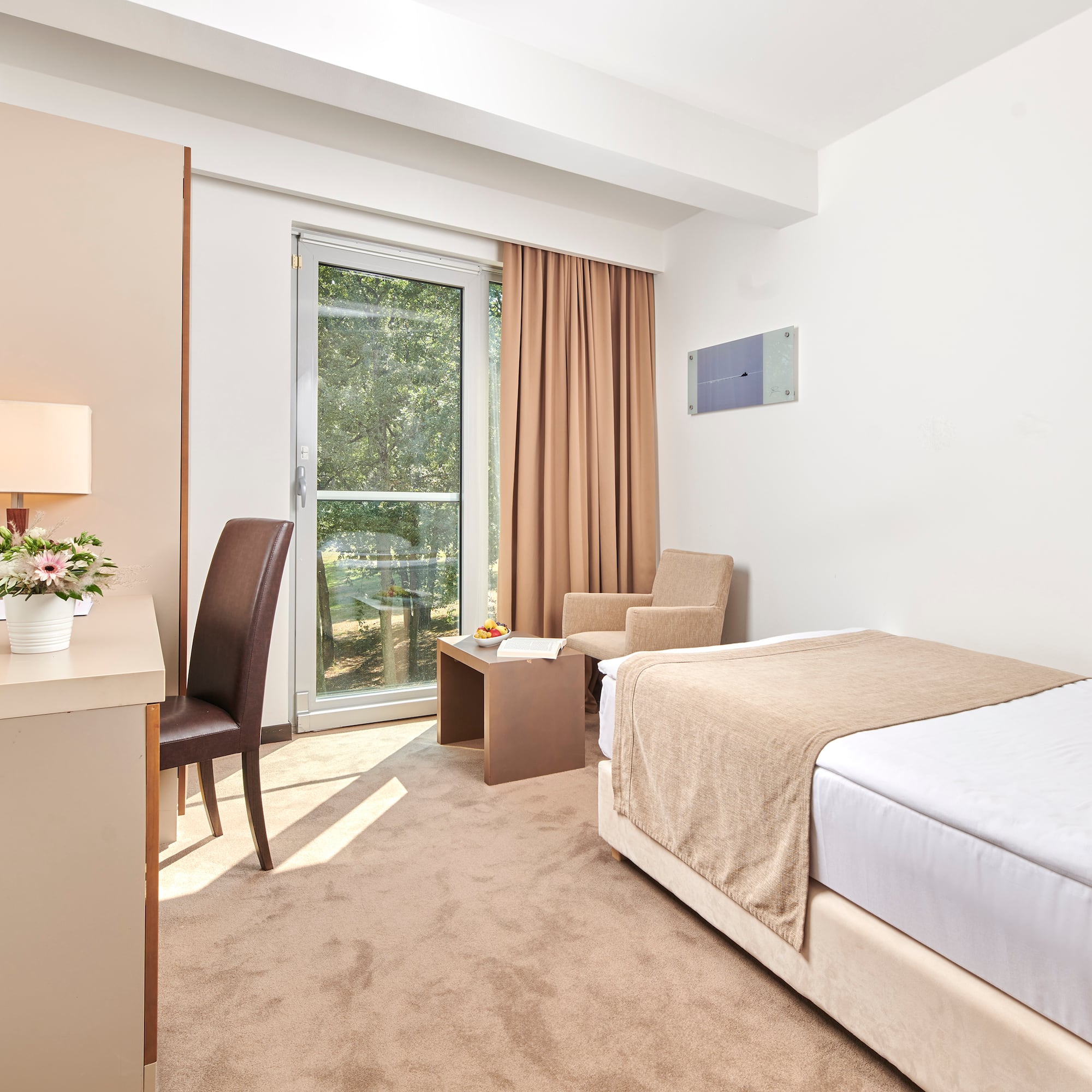 a bedroom with a bed and a desk