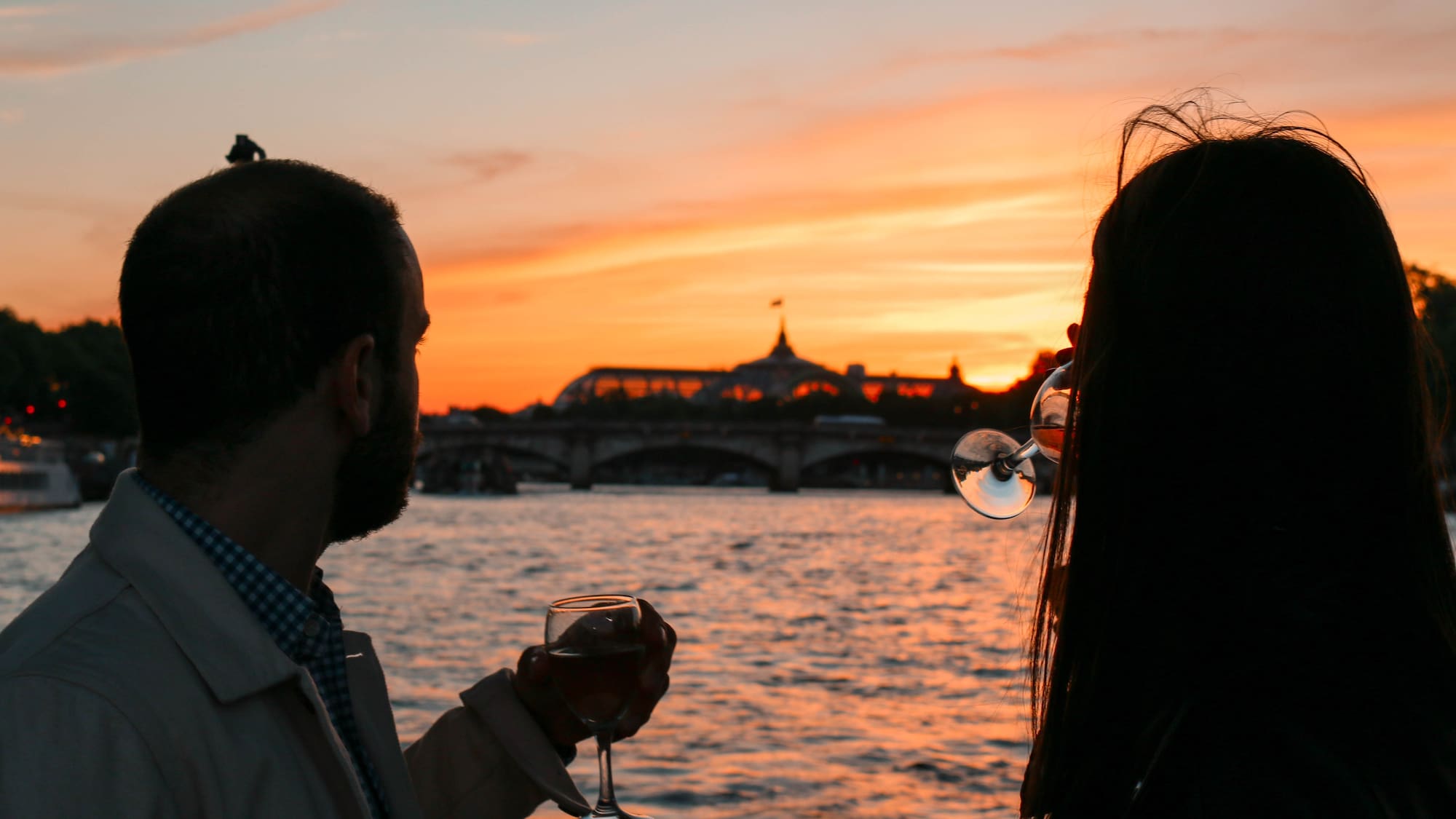 a man and woman drinking wine