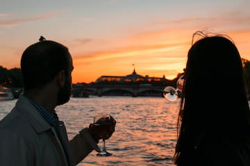 a man and woman drinking wine