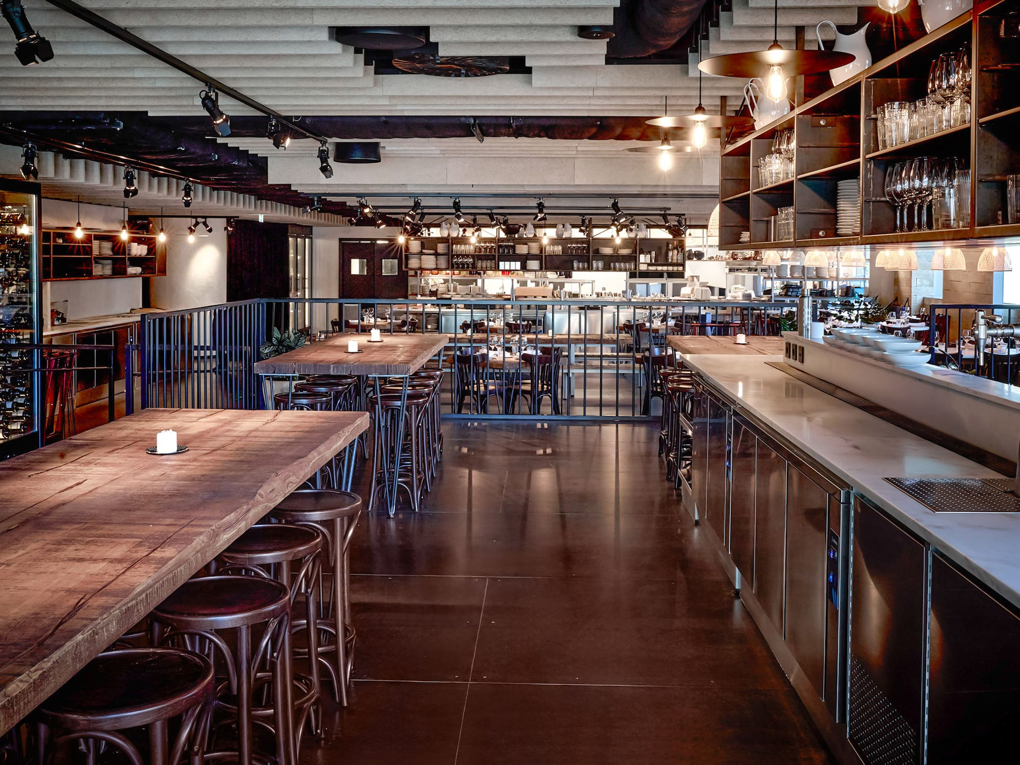 a large room with tables and stools