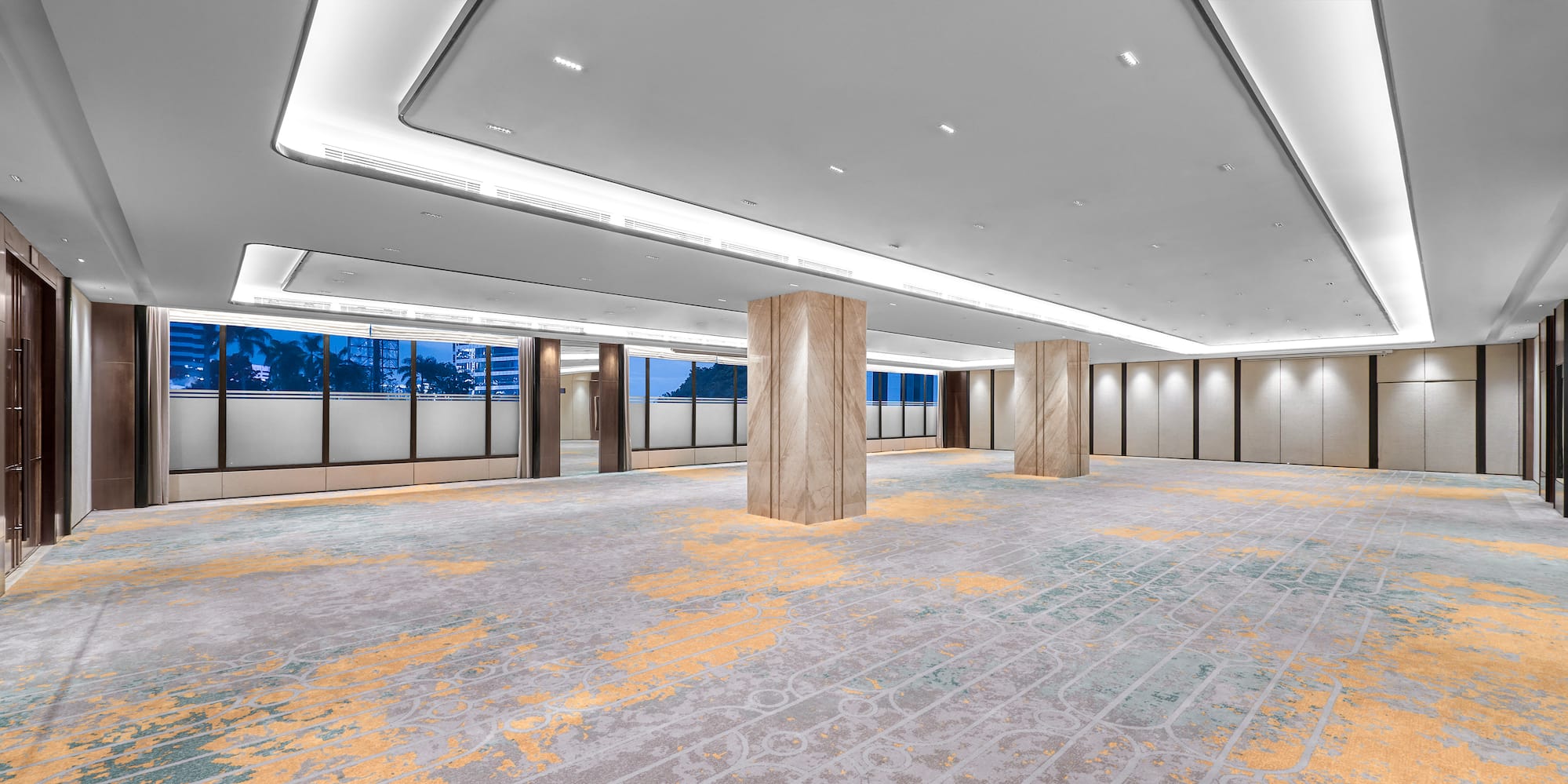 a large room with columns and carpet