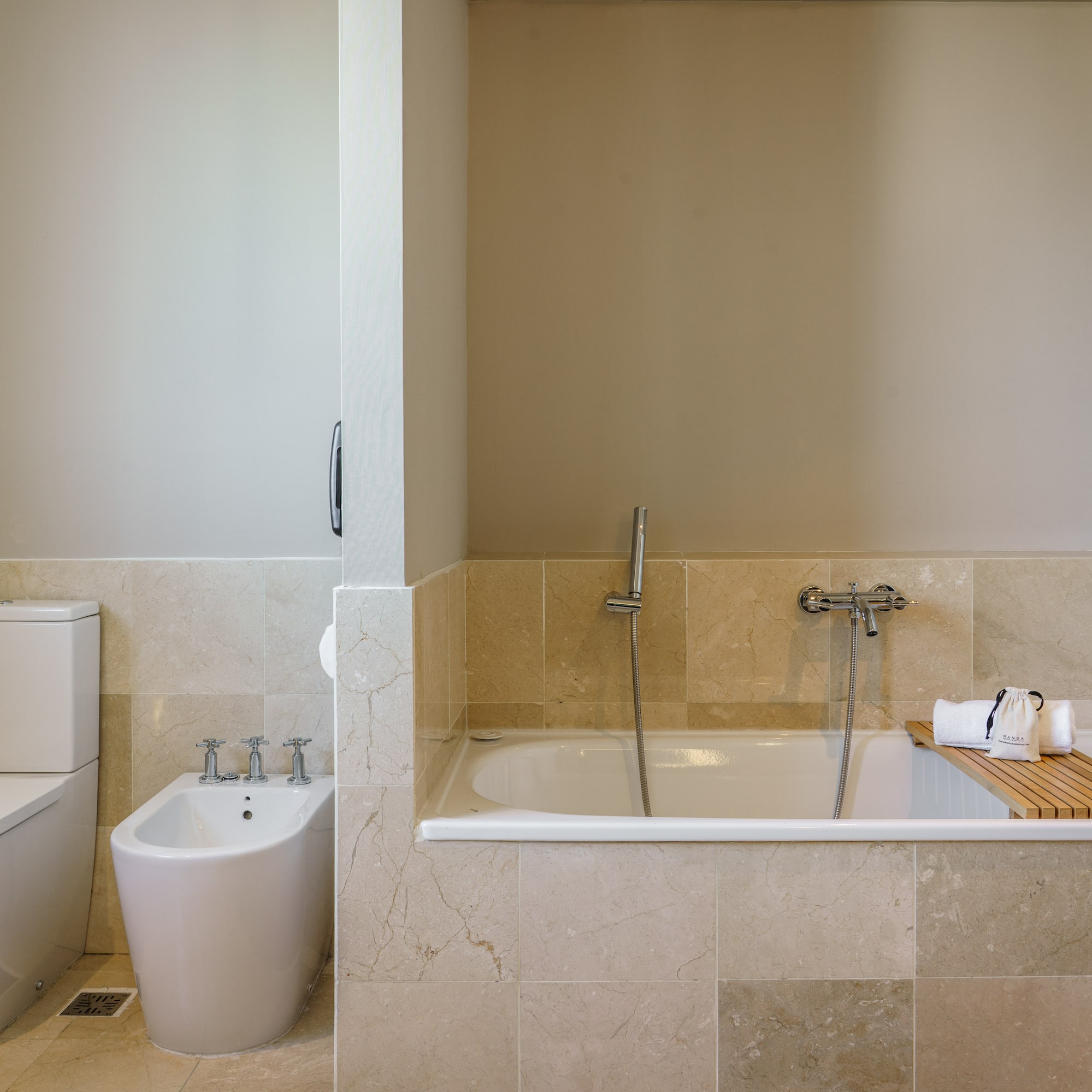 a bathroom with a bathtub and toilet