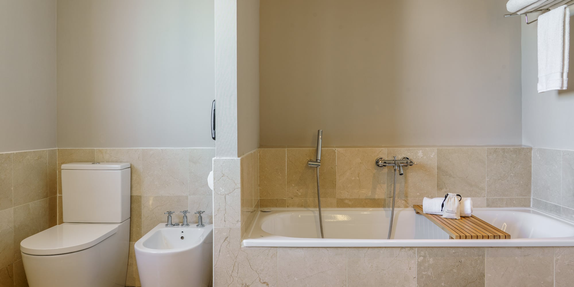a bathroom with a bathtub and toilet
