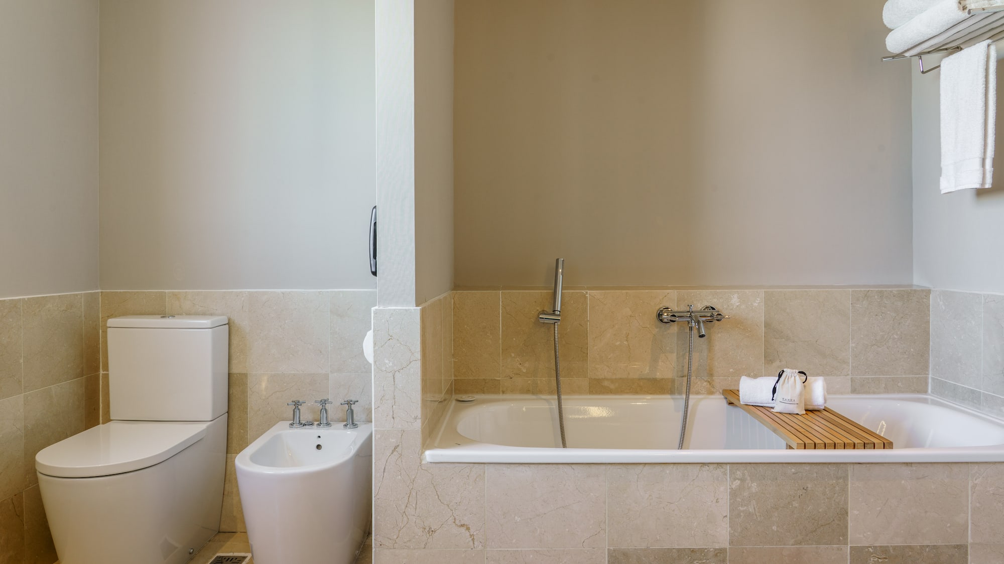 a bathroom with a bathtub and toilet