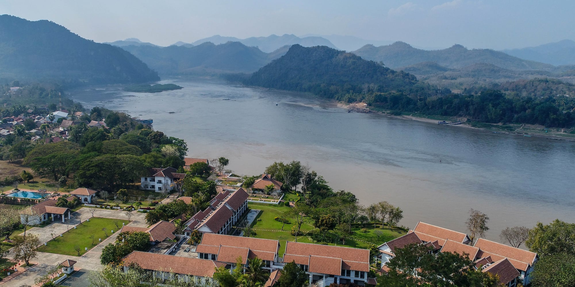 a group of houses next to a river