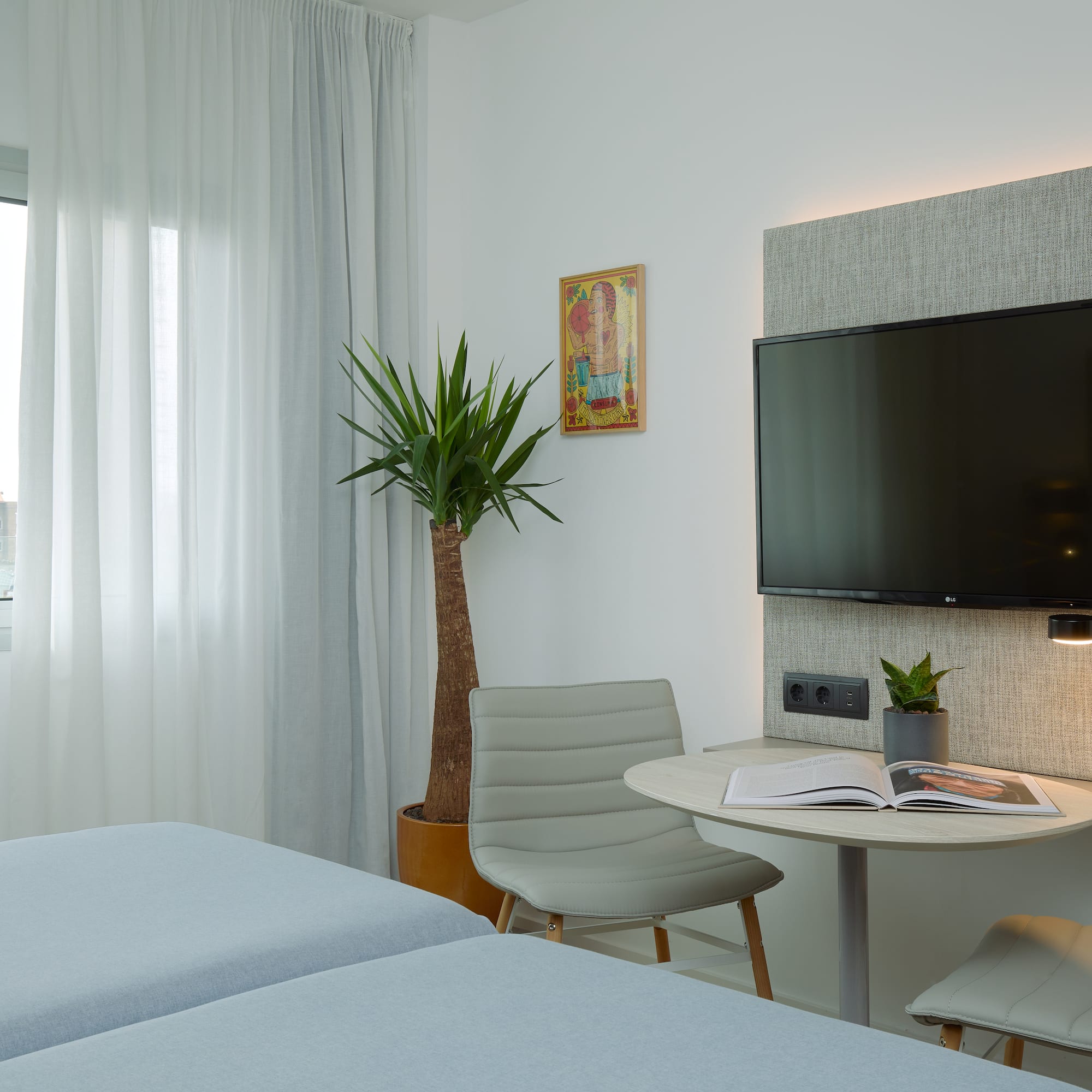 a room with a tv and a table