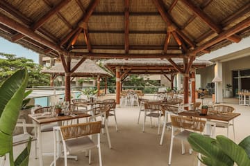 a restaurant with tables and chairs