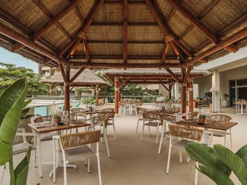 a restaurant with tables and chairs