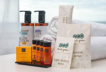 a group of bottles of shampoo and a towel