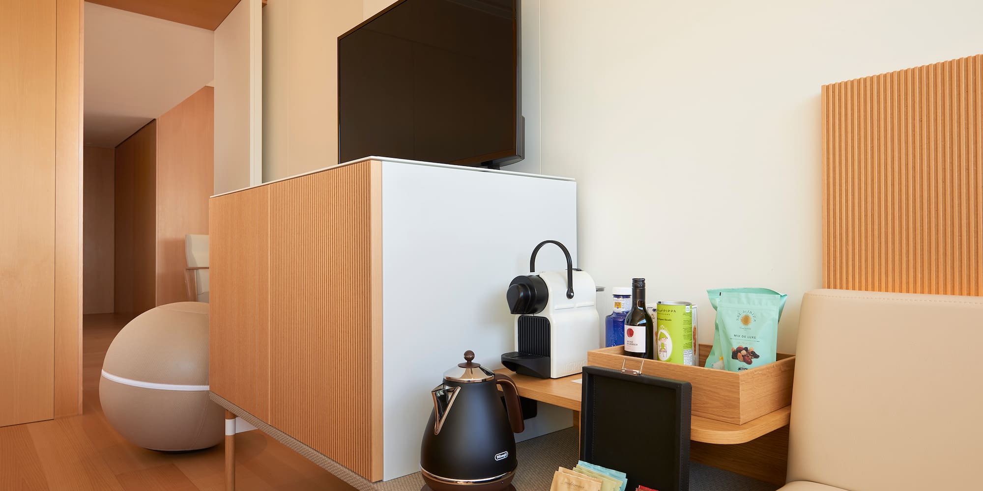 a room with a tv and coffee pot