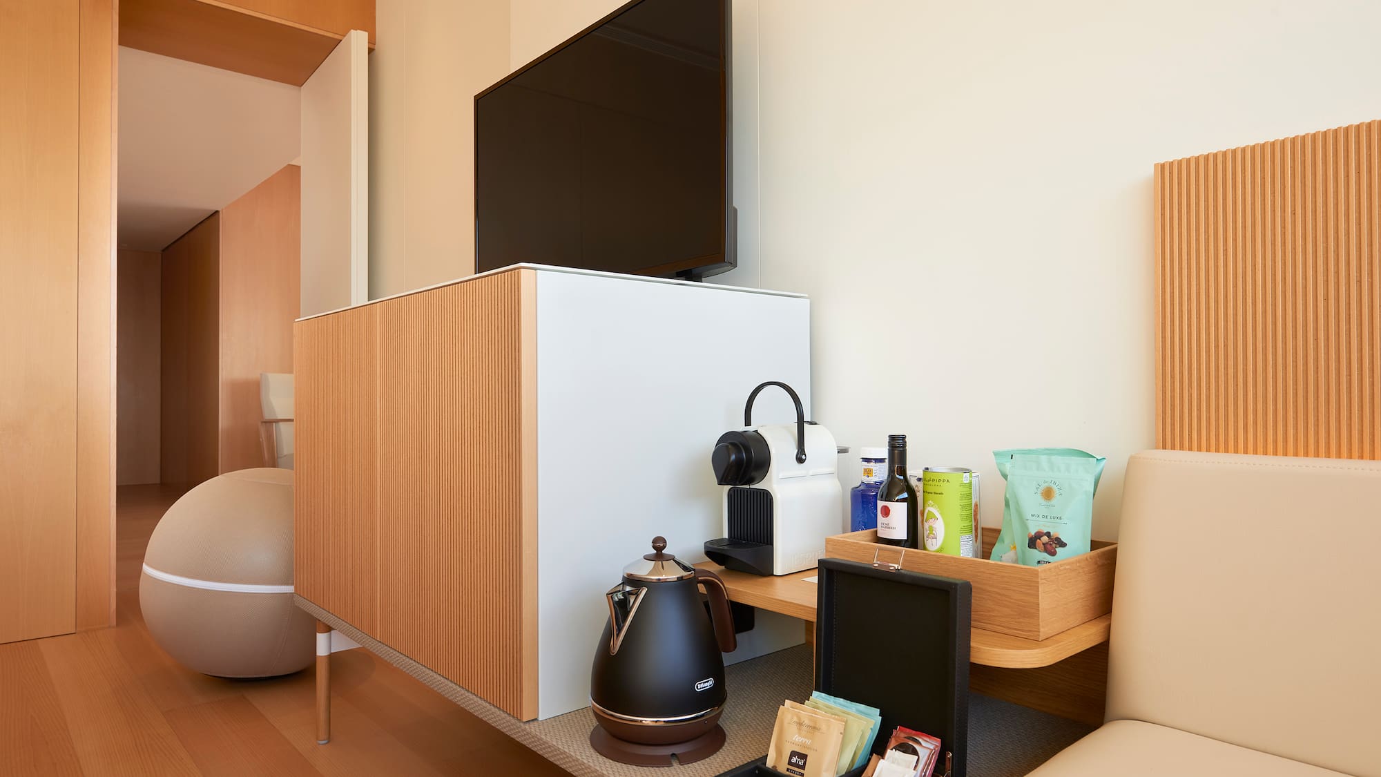 a room with a tv and coffee pot