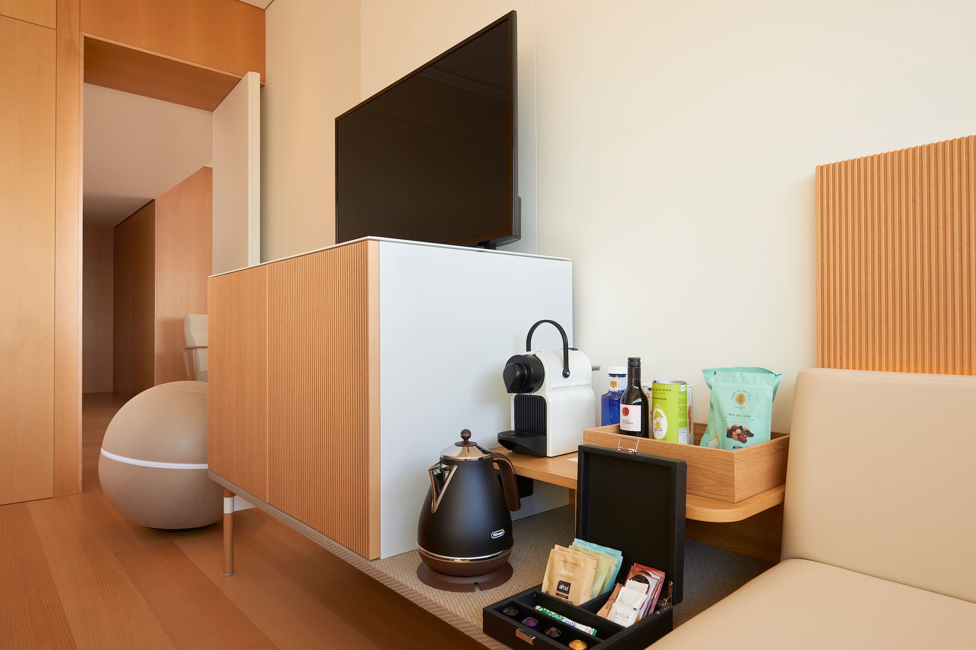 a room with a tv and coffee pot