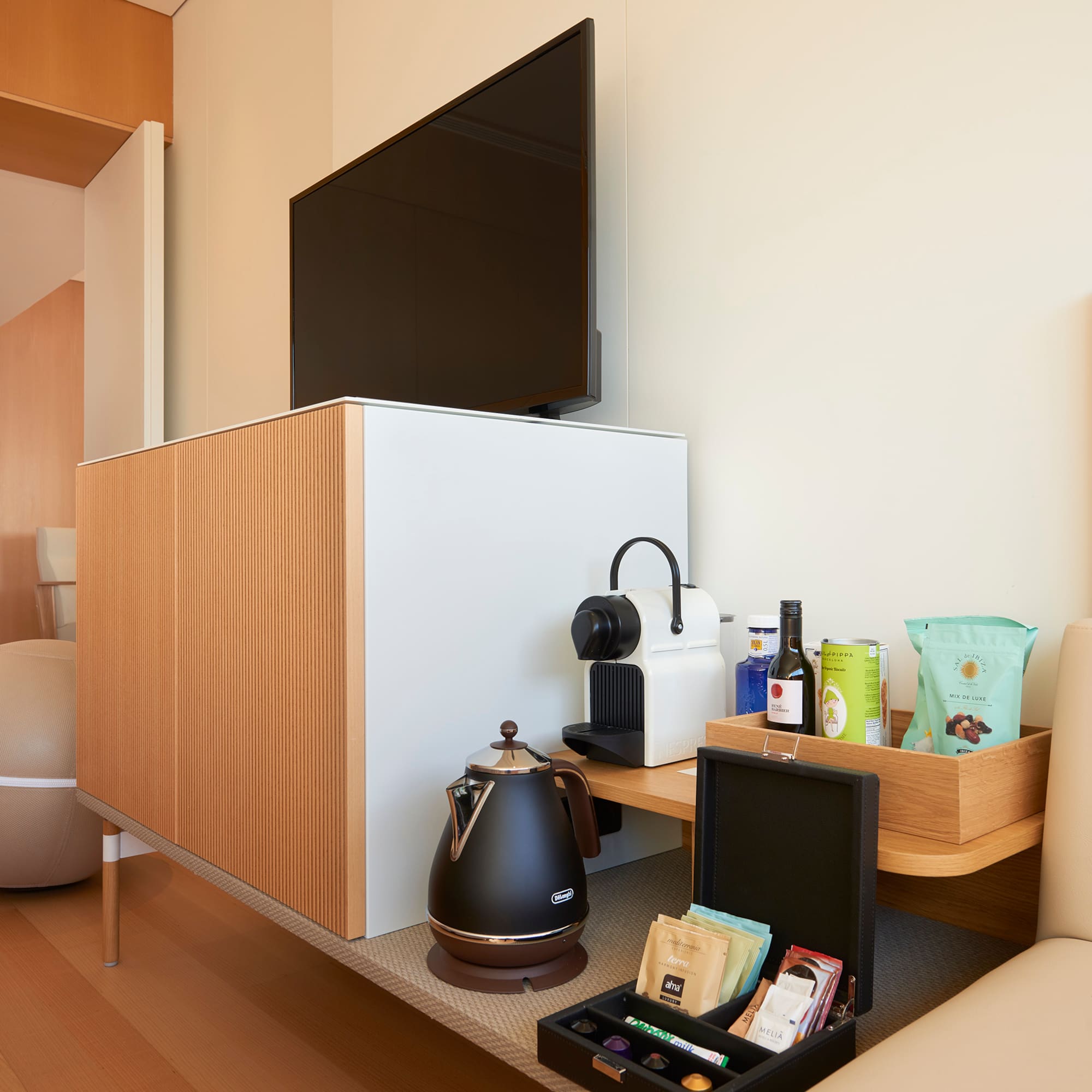 a room with a tv and coffee pot