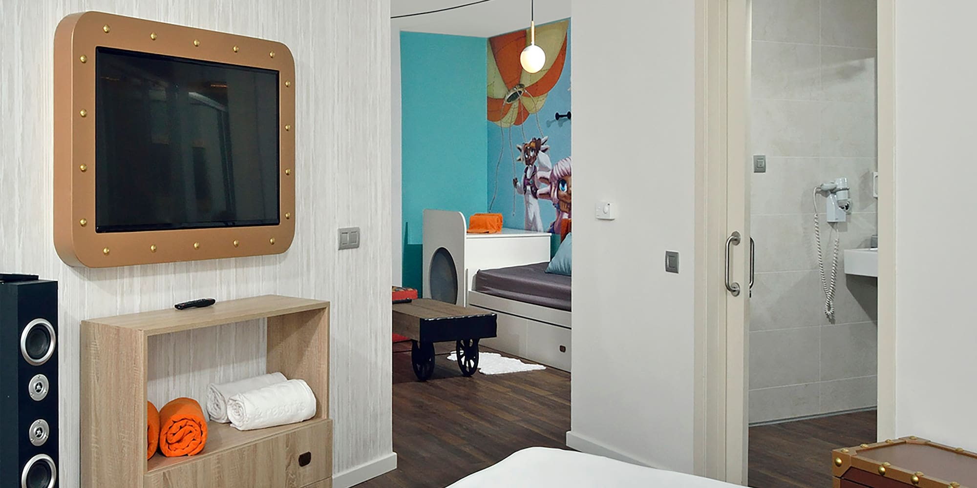 a room with a tv and a bed