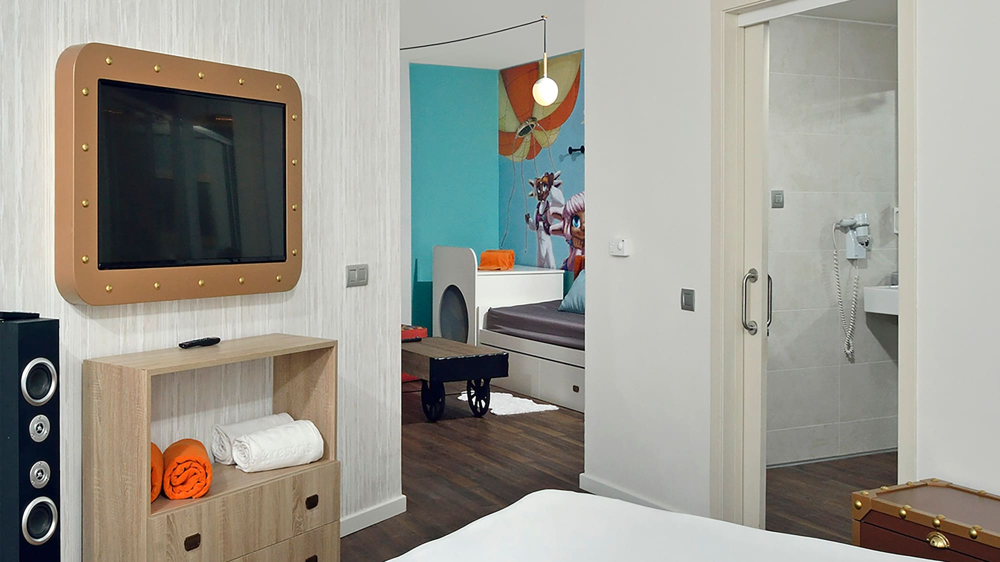 a room with a tv and a bed