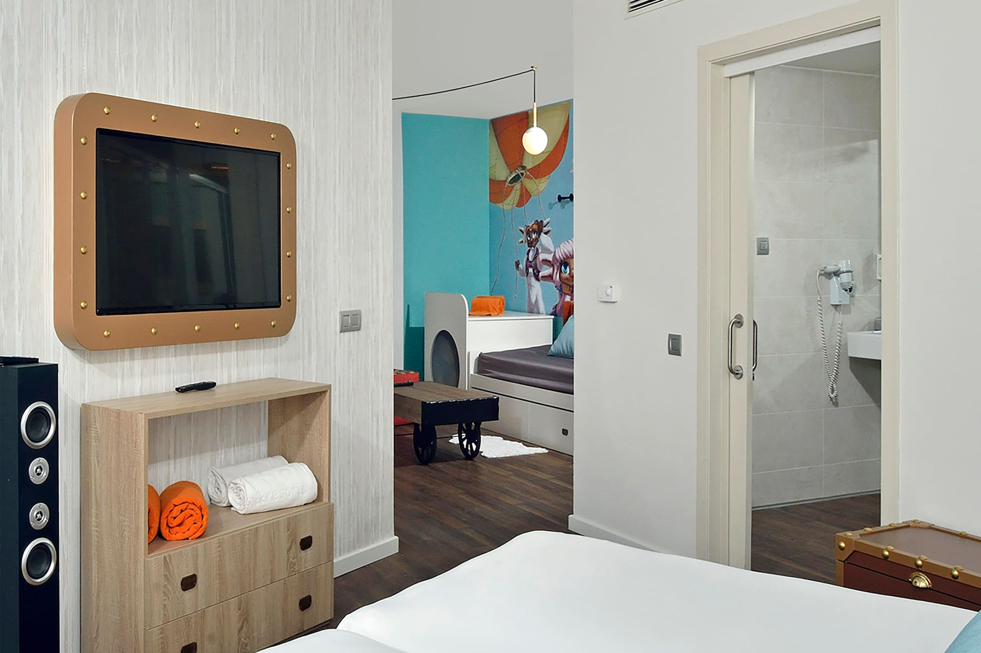 a room with a tv and a bed