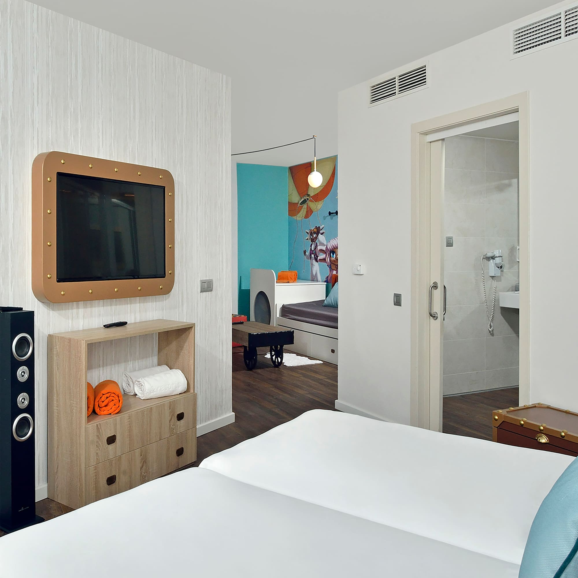 a room with a tv and a bed